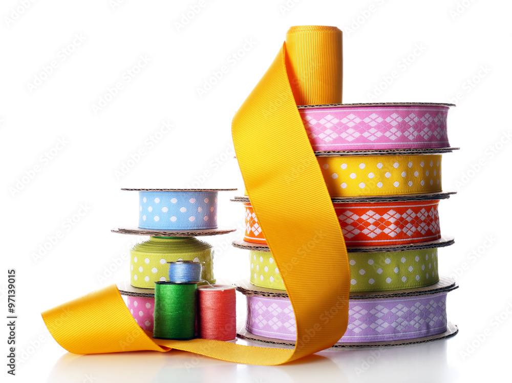 Spools of color ribbon and thread, isolated on white