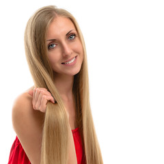  Portrait of a beautiful young smiling woman with luxurious long hair	