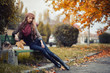 © endrews21 - slender young brunette beautiful girl with long hair in a beret with a scarf and coat walks in autumn park with a lot of yellow and orange leaves