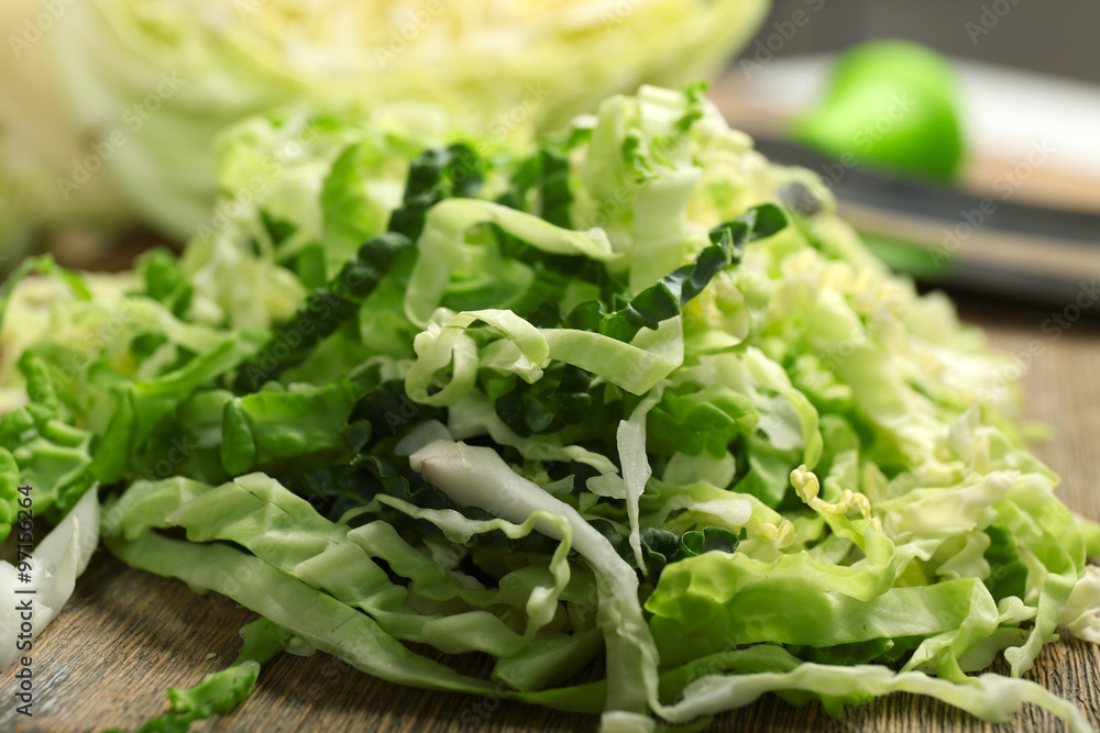 Cut savoy cabbage on cutting board closeup