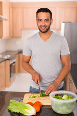 Wall Mural - young indian man cooking