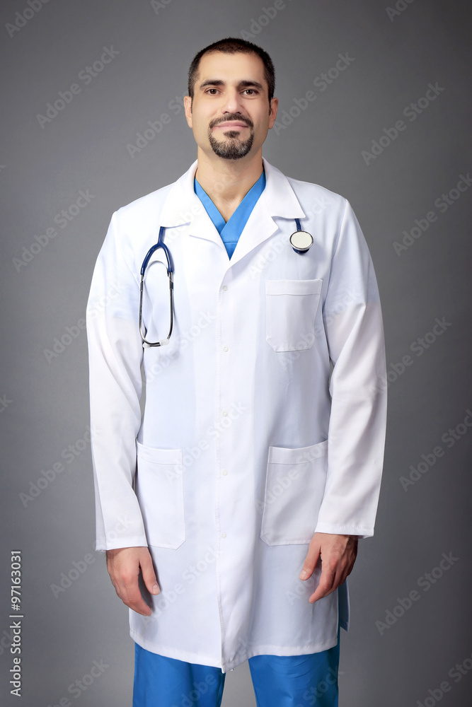 Portrait of a doctor on grey background