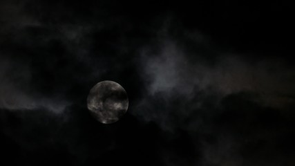 Wall Mural - timelapse with full moon moving between clouds, 4k