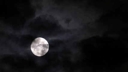 full moon moving between clouds, 4k