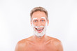 © deagreez - Handsome funny  man with shaving foam on his chin and eyebrows