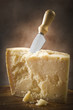 Parmesan cheese cutting on the chopping board