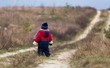 © milosz_g - Child walking in countryside at autumnal bad weather