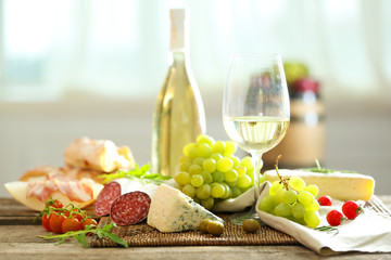 Still life with various types of Italian food and wine