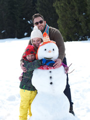 Canvas Print - happy family making snowman