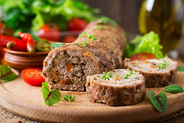 Minced meat loaf roll with mushrooms and carrots