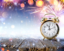 Midnight Celebration - Clock On Snowy Table With Fireworks
