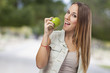 © asierromero - beautiful young woman eating a green apple