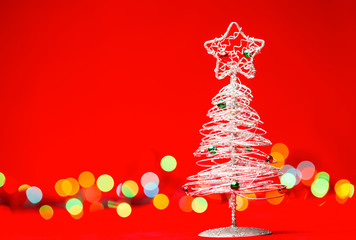 Wall Mural - Tabletop Christmas tree on red background