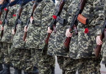 Armed Soldiers in Camouflage Uniforms