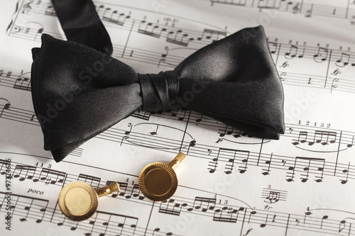 Fotografie, Obraz Formal Black Bow Tie and Cuff Links on Sheet Music