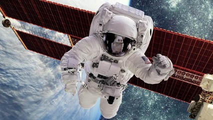Wall Mural - astronaut in outer space against the backdrop of the planet earth. elements of this image furnished 