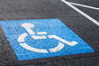 Handicapped parking spot symbol on asphalt