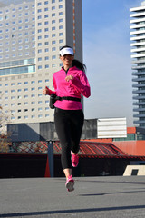 Wall Mural - woman practicing running in the city