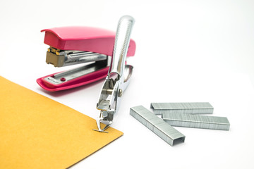 pink stapler on the white background