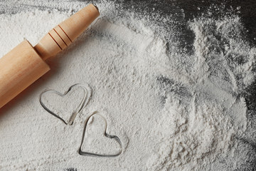 Canvas Print - Hearts of flour and rolling pin on gray background