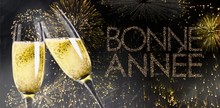 Champagne Glasses Clinking Against Glittering Bonne Annee
