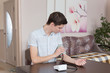 © monoliza - the young guy measures a blood pressure