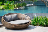 Fototapeta Na drzwi - Relaxing Rattan Sofa At Swimming Pool