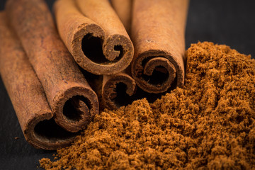 Wall Mural - Cinnamon sticks with powder