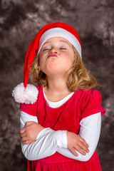 Wall Mural - funny girl in Santa- Claus dress