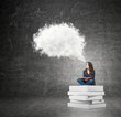 © ImageFlow - woman sitting on a pile of books thinking about problem