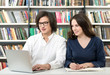 © ImageFlow - man and woman studying and working in the library