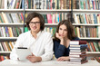 © ImageFlow - man and woman studying and working in the library