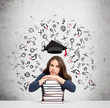 © ImageFlow - woman with hands and head on pile of books thinking