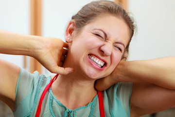 Wall Mural - Overworked woman suffering from neck pain.