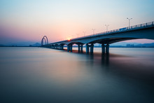 Sunrise,sunset Skyline And Bridge Over River