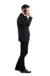 © sharplaninac - Young businessman talking on the cell phone walking side view. Full body length portrait isolated over white studio background.