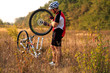 © Aleksey - Bike repair. Young man repairing mountain bike