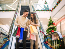 Loving Couple Doing Christmas Shopping Together
