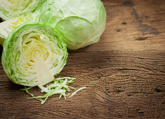 Wall Mural - cabbage and cutted cabbage on wooden