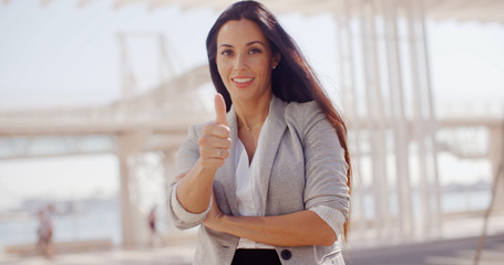 Poster - Motivated young woman giving a thumbs up