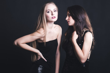 Two young girl friends standing together