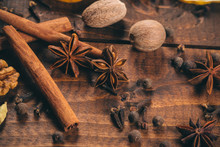 Collection Of Spices For Mulled Wine And Pastry On The Wooden Table