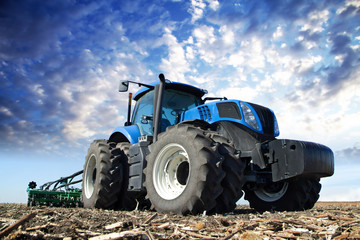Poster - Blue tractor working on the farm