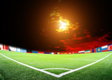 Fototapeta Sport - lights at night and big soccer stadium