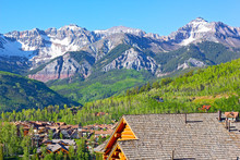 Telluride City Panorama With Snow Mountain Peaks And Forestry Hillsides. Beautiful Town At High Altitude On A Sunny Day In Colorado, USA.