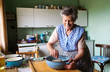 © Halfpoint - Senior woman baking