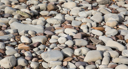 Grey pebbles stones and shingle background texture beach St Audries Bay Somerset uk