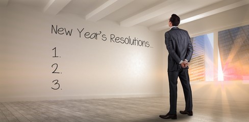 Poster - Composite image of businessman in grey suit looking