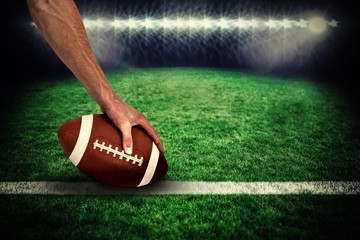 Poster - American football player placing ball