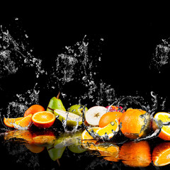 Pears, apples, orange  fruits and Splashing water